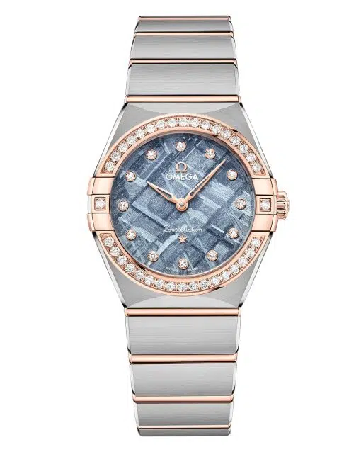 Produktbilde av Omega Constellation 28mm med blå urskive og gull og stållenke. Ref. O13125286099001.