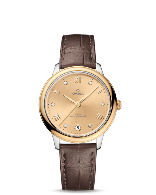 Produktbilde av Omega De Ville Prestige Co-Axial Master Chronometer 34MM med gullfarget urskive og brun skinnrem. Ref. O43423342058001.